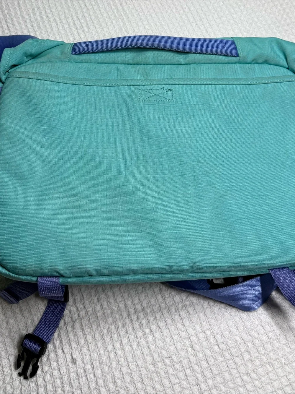 Patagonia Teal Messenger Bag with Yellow Zipper and Purple Strap